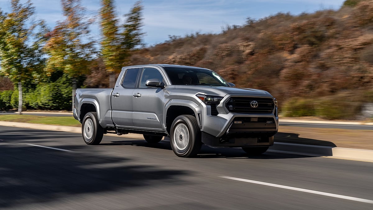 Toyota Tacoma driving on road with motion blur action shot