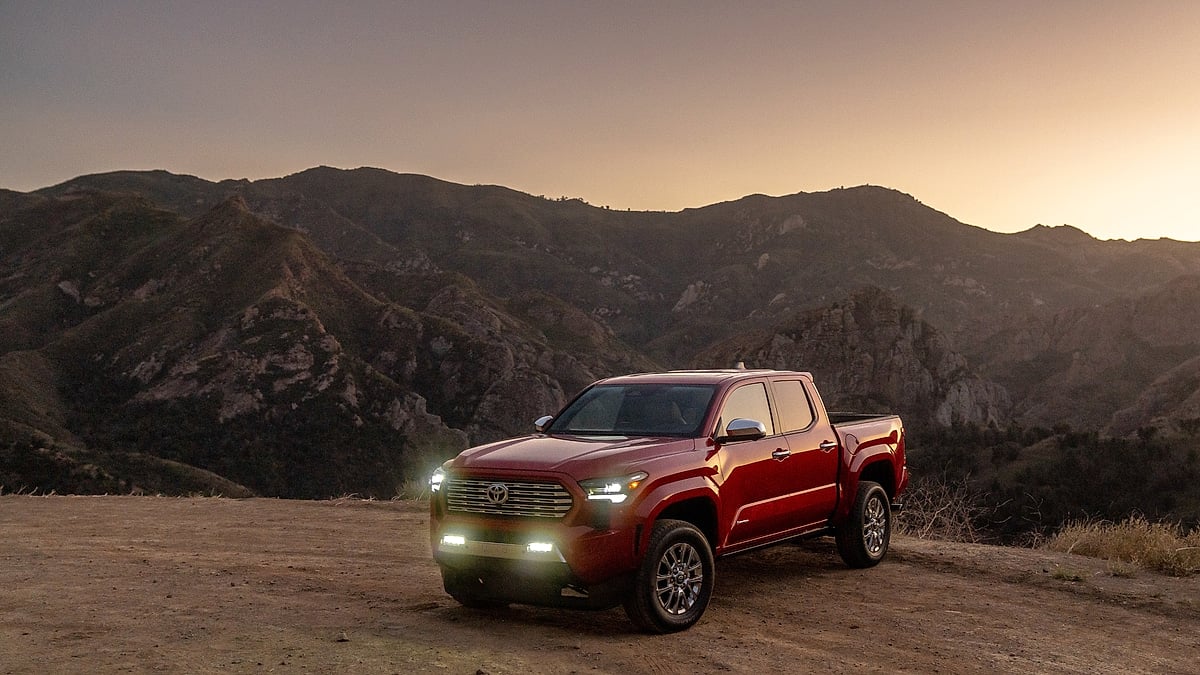 Toyota Tacoma parked on mountain overlook at sunset