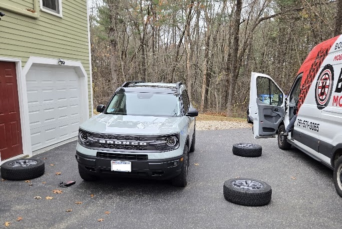 A Ford Bronco Sport is shown getting new tires