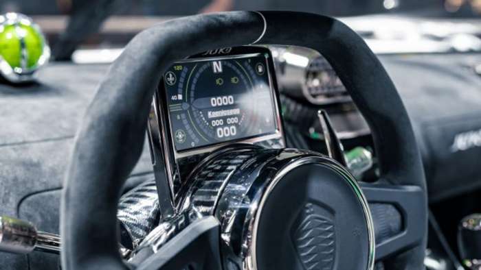 Image showing the small fixed screen mounted to the steering wheel which serves as the Jesko Absolut's instrument cluster,