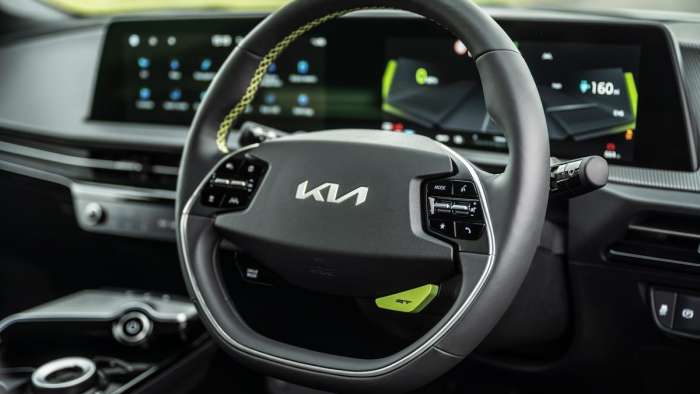 Image showing the Kia EV6 GT steering wheel with GT button that optimizes the vehicle's systems for spirited driving.