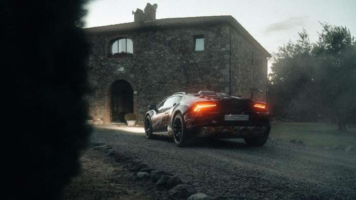 Rear view of the Lamborghini Huracan Sterrato showing its rear window louvres and roof-mounted air scoop.