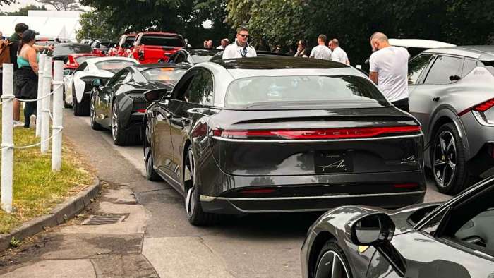 Rear image of the Lucid Air Grand Touring Performance lined up at Goodwood between a McLaren and a Ferrari
