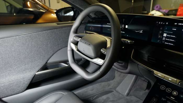 Image of the Lucid Air Pure's steering wheel and gauges. The Pure is the least expensive Air variant but still features a luxurious interior.