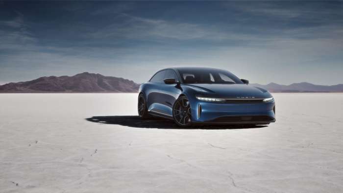 Image of the dark blue Lucid Air Sapphire parked in the desert featuring Lucid's blacked-out Stealth Look package. The Sapphire looks lower and meaner than other Airs in the range.