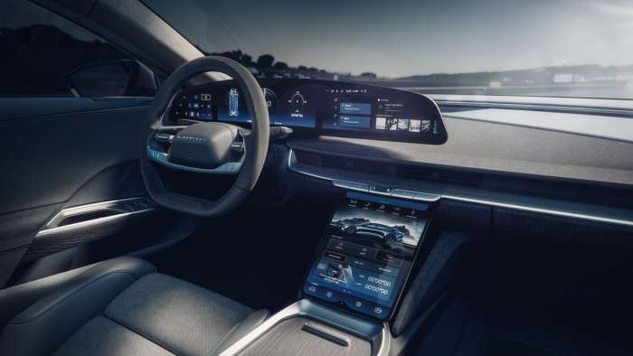 Interior of the Lucid Air Sapphire showing its model-specific screens with lap timers and blue tints.