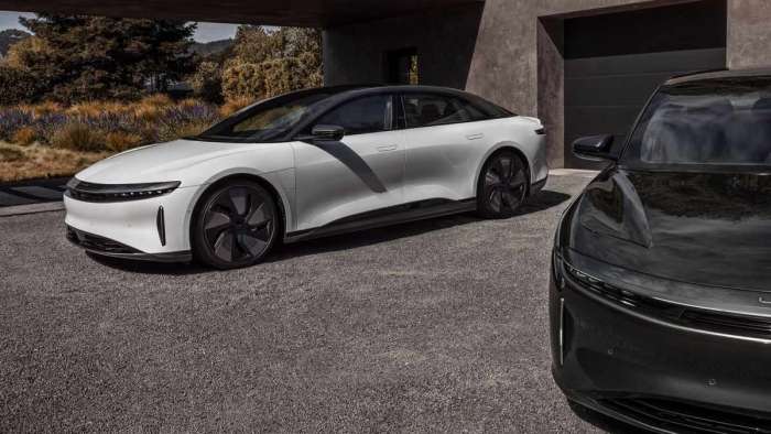 Image of a white Lucid Air Stealth Look with a black version in the foreground.