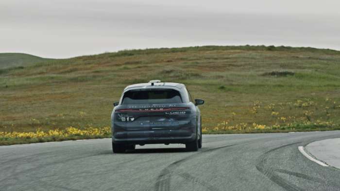 Image of a camo-wrapped Lucid Gravity SUV undergoing public road testing.