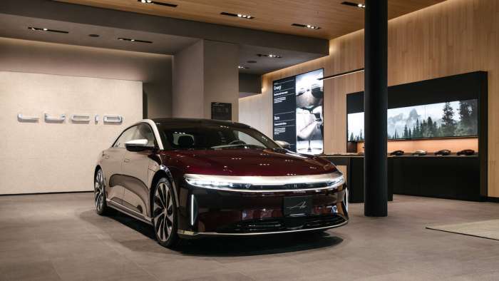 Image of a black Lucid Air parked inside the new Studio location in Oslo, Norway.