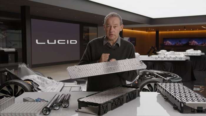 Image showing Lucid CEO Peter Rawlinson holding up one of the Lucid Air's battery modules during a tech talk on the Lucid YouTube channel.
