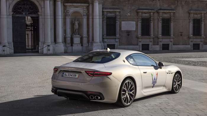 Rear view of the new Maserati GranTurismo parked in a courtyard.