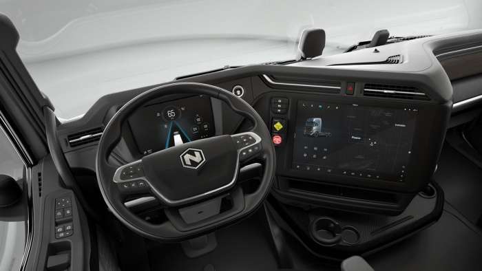 Image showing the interior of the Nikola Tre, complete with large screen tilted towards the driver.