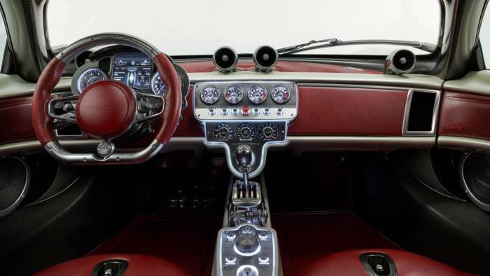 Interior of the Pagani Utopia showing its analog gauges and exposed shifter linkage.
