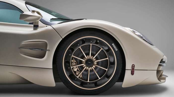 Close-up shot of the front wheel, fender and door of the Pagani Utopia showing its bespoke tires.