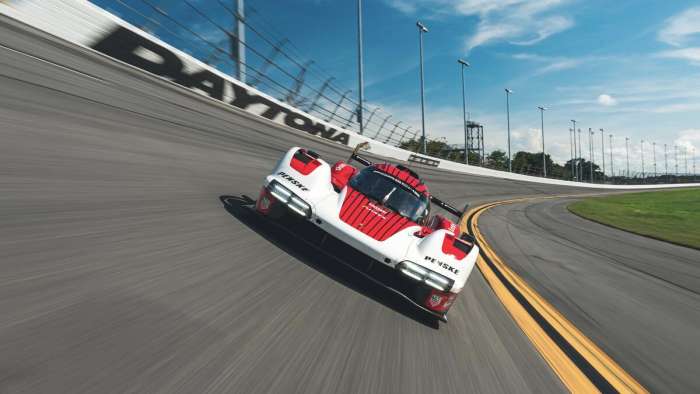 Front view of the Porsche 963 as it drives on the banking at Daytona.
