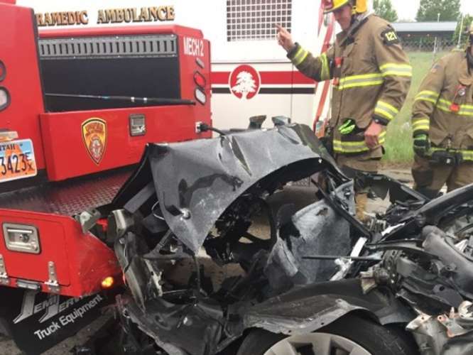 Crumpled Tesla Near Fire Truck