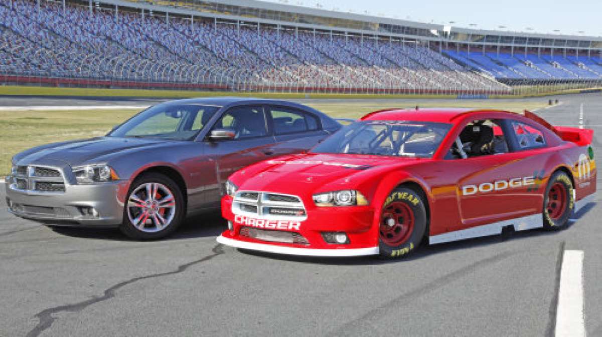 The 2013 Dodge Charger stock car with the 2012 Dodge Charger road car