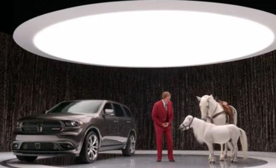 Ron Burgundy with the Dodge Durango and 2 horses