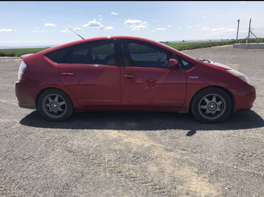 2007 Red Toyota Prius with 250,000 miles 