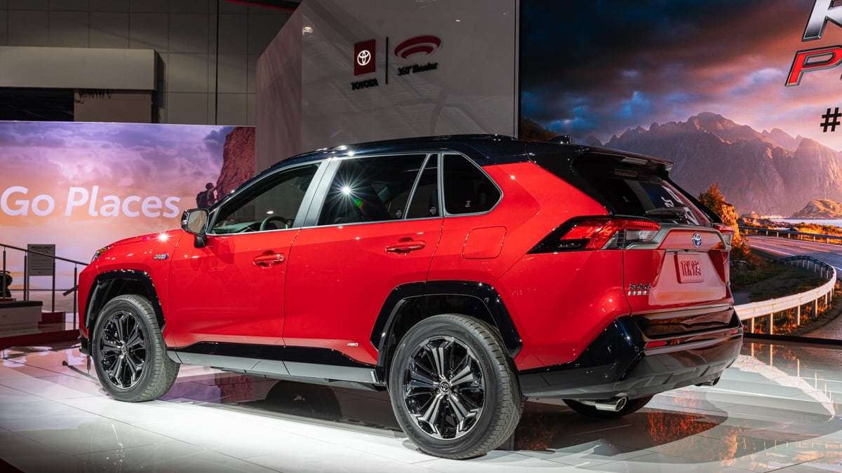 2021 Toyota RAV4 Prime XSE Supersonic Red color profile view back end view