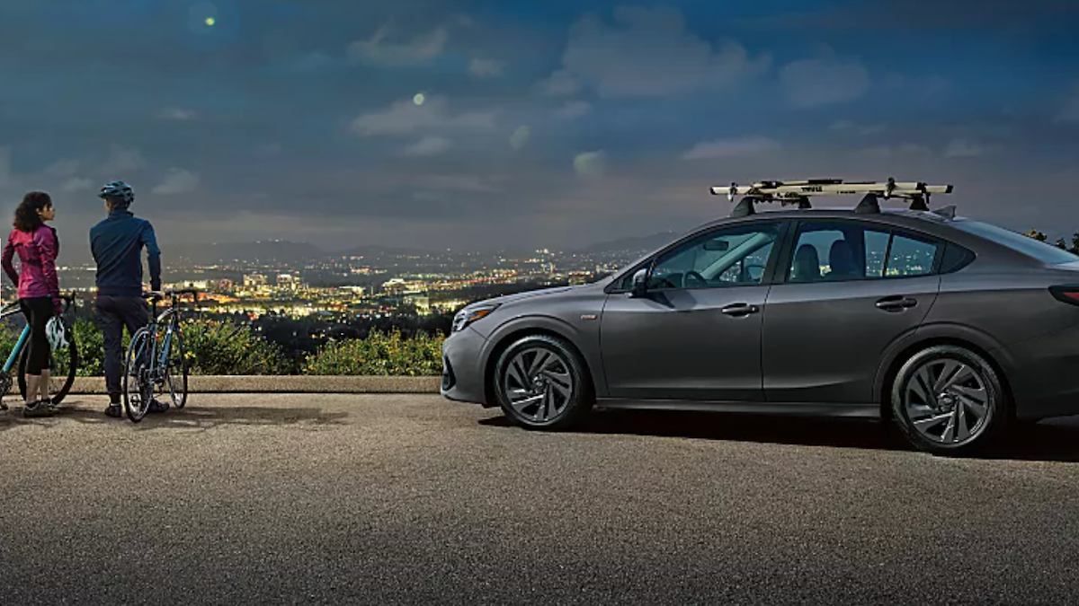 2024 Subaru Legacy with customers in a city overlook