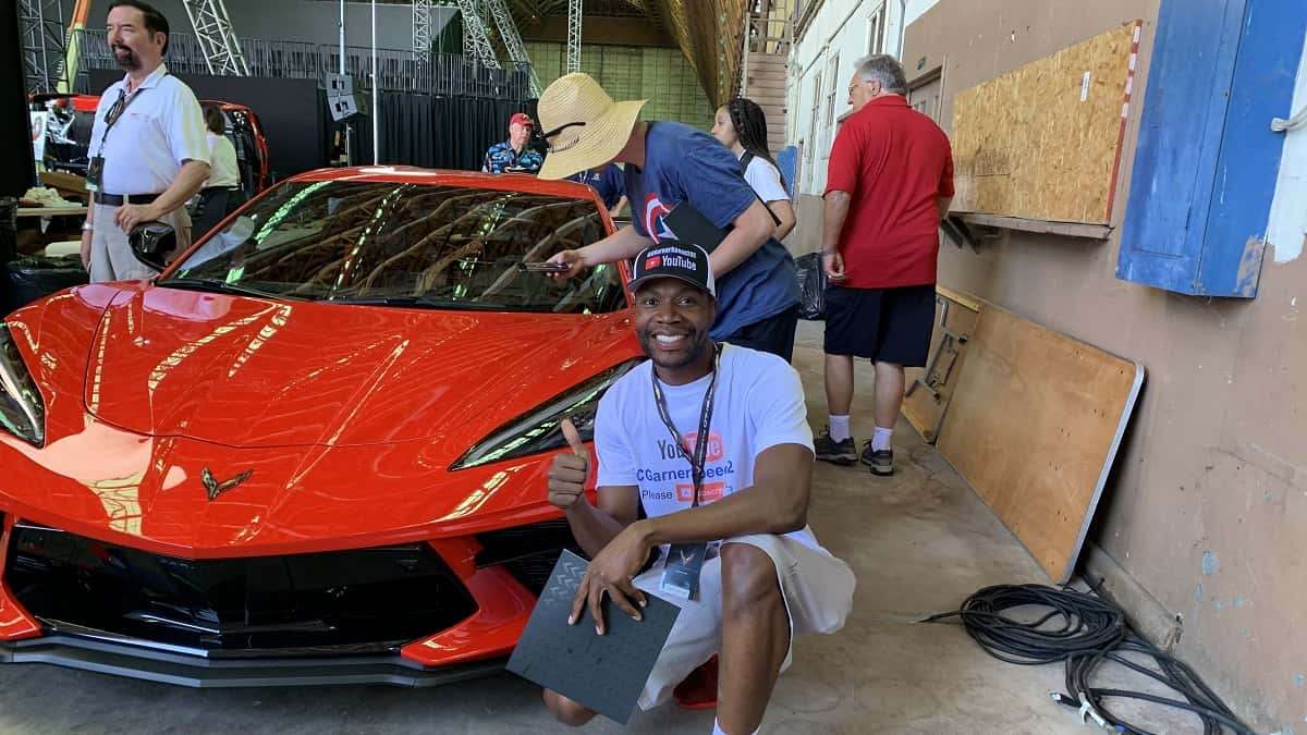 Clarence Garner of Torque News in front of the 2020 Chevy Corvette in C8 unveling in Tustin California