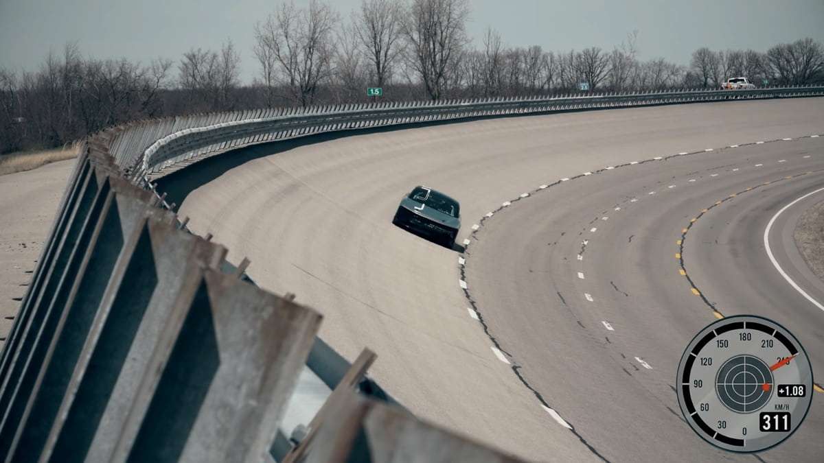 Image showing the Lucid Air Alpha Speed Prototype on the curved banking at Ohio's Transportation Research Center.