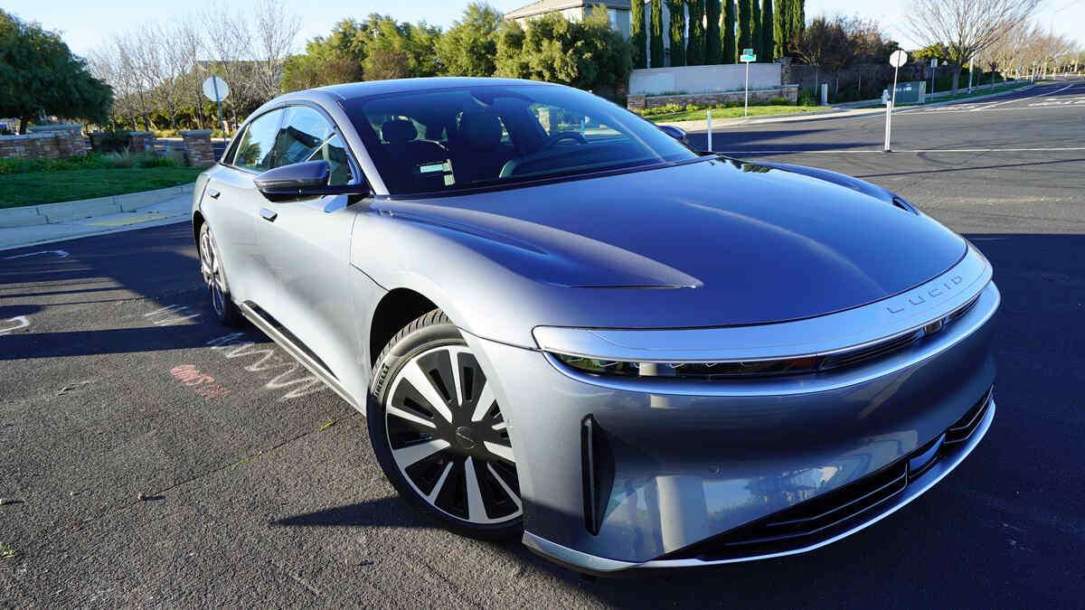 Image of the front of a Lucid Air Pure painted Fathom Blue, a light silvery shade of blue. It wears the more efficient 19-inch wheels.