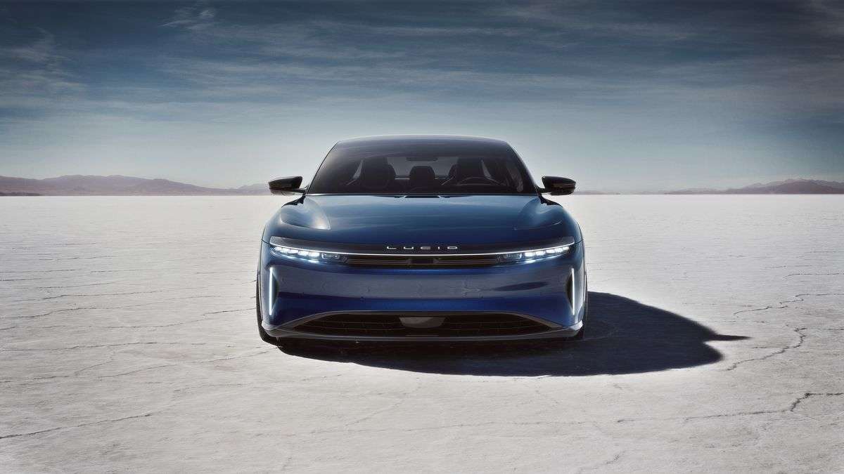 Front view of the Lucid Air Sapphire parked in a desert. The Sapphire wears its trademark blue paint and comes with Lucid's 'Stealth Look' package with blacked-out trim.