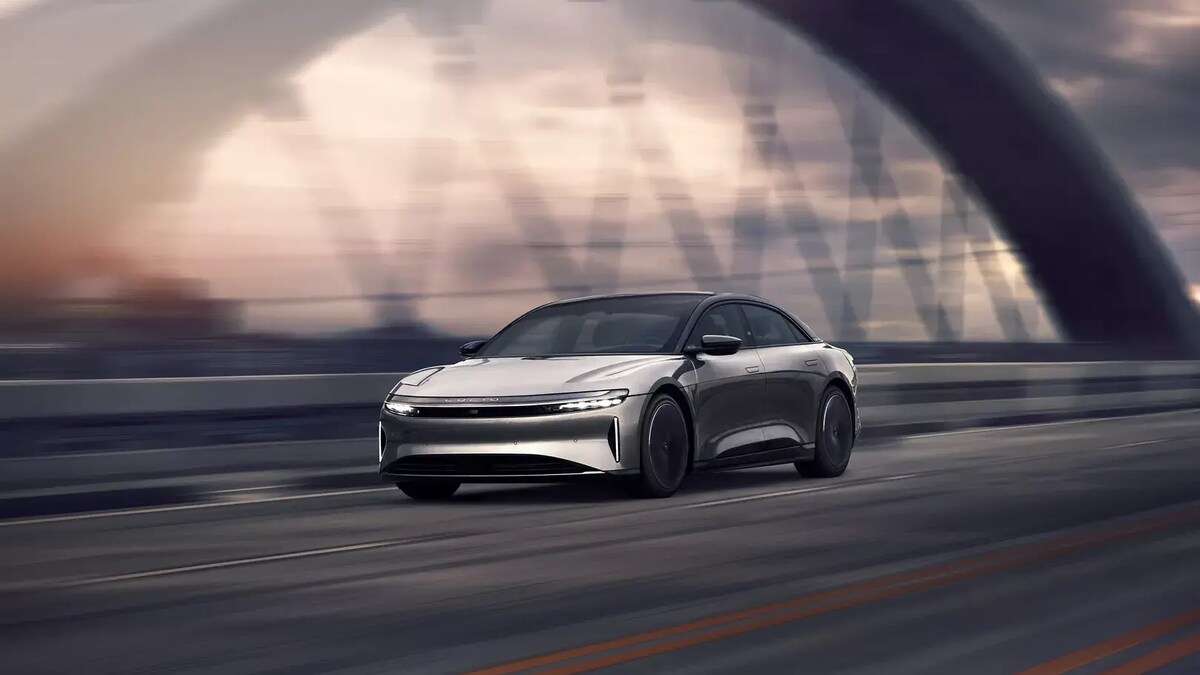 Image showing a Lucid Air with Stealth Appearance Package driving on a bridge.