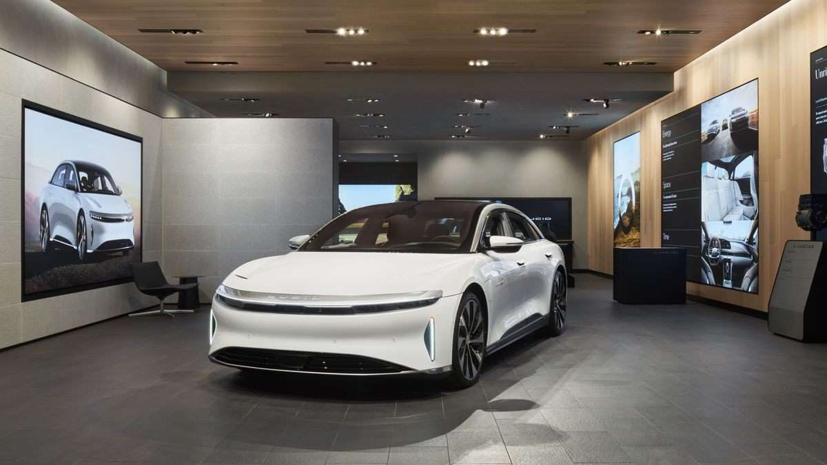 A white Lucid Air Grand Touring is pictured parked at Lucid's newest Studio location in Toronto's Yorkdale Mall