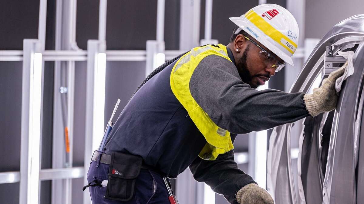Image of auto worker in Alabama courtesy of Toyota