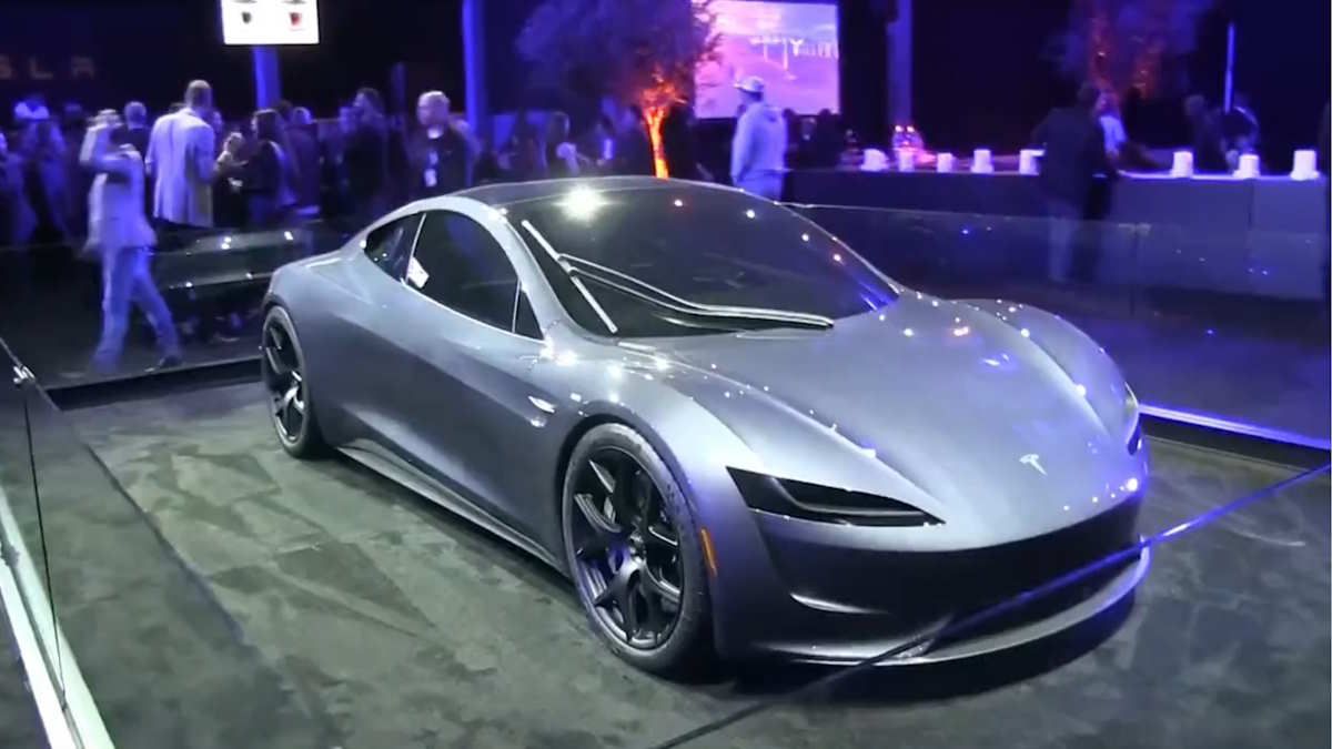 Stunning New Tesla Roadster With A Silver Body Seen On Display - With a Single Windshield Wiper