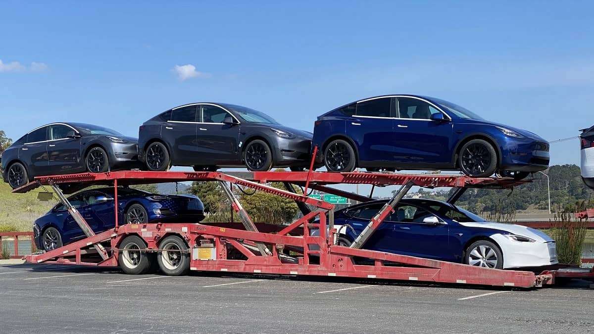 Tesla car deliveries on a truck.