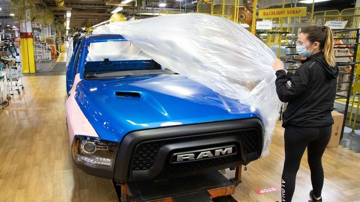 Warren Truck Employee Uncovering a 2020 Ram 1500