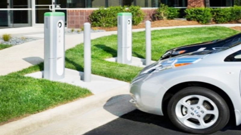 Electric fleet vehicles charge at commercial Plugless Power wireless charging st