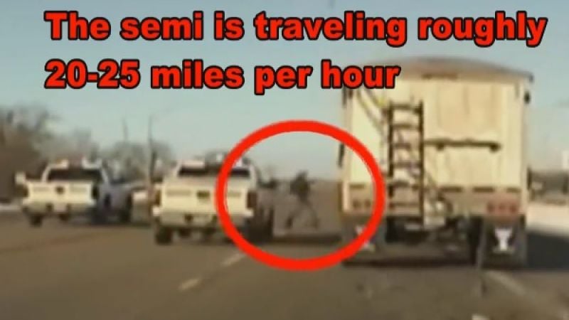 police from truck jumps into semi-truck