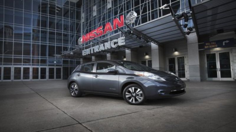 Nissan LEAF in front of Nissan building