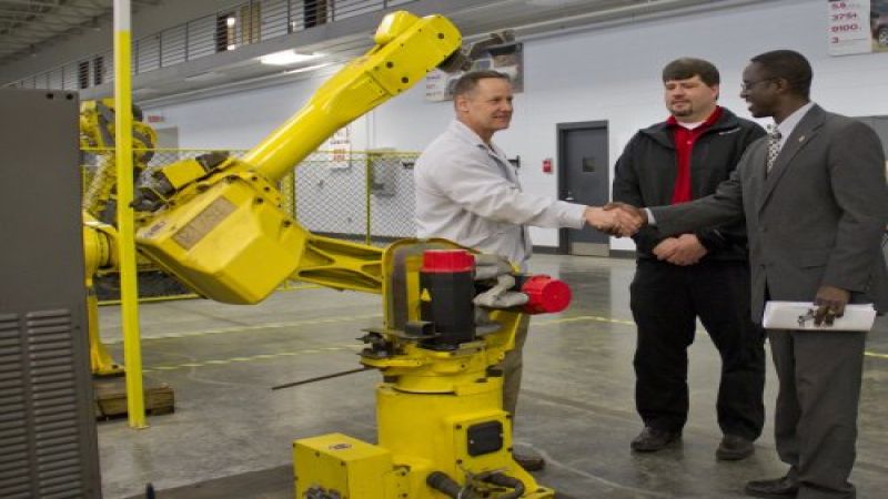Dan Bednarzuk of Nissan Canton and faculty from Alcorn with robot