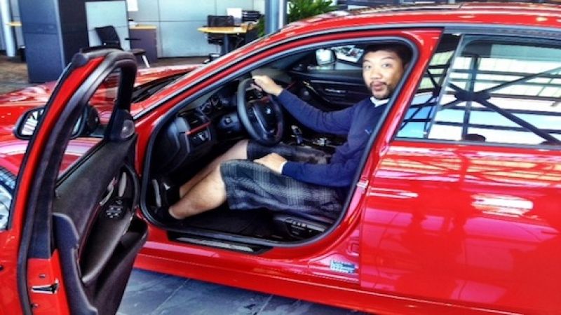 Earl Duque sitting in a 2012 BMW 3-Series