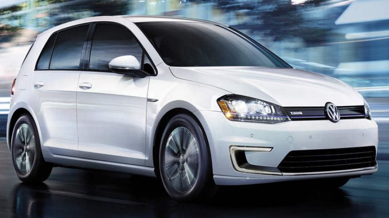 The e-Golf, VW's current electric vehicle, runs along a street at night. VW plans a massive increase e-vehicle output by 2025.