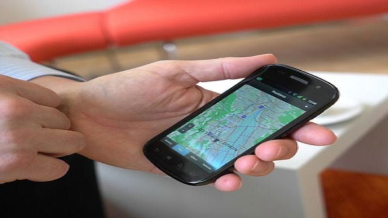 An image of someone using the IBM smartphone EV charging app