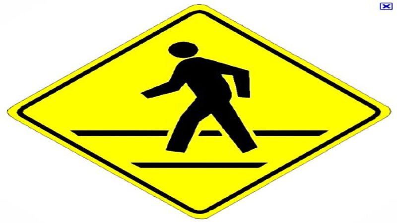 A pedestrican crossing sign indicates one place where TRW's system could help. 