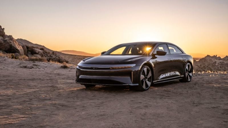 2022 Lucid Air electric luxury sedan shown from front three-quarter angle in desert landscape at sunset