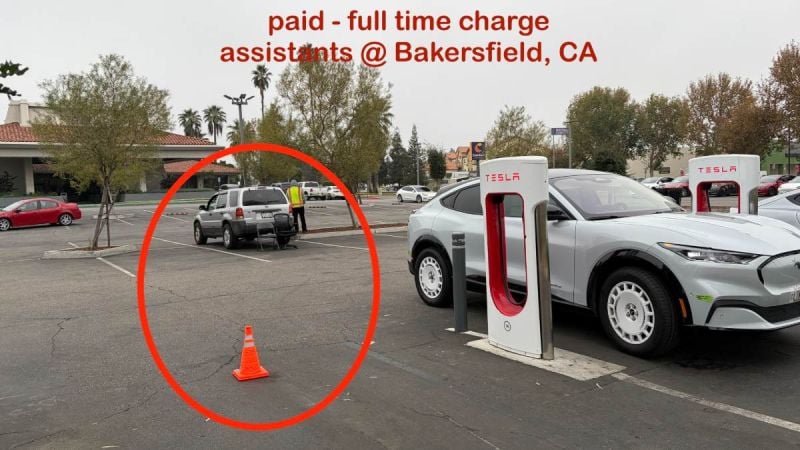 Tesla Supercharger station in Bakersfield, CA showing multiple charging stalls with a silver Tesla Model Y in the foreground, viewed from a three-quarter front angle.