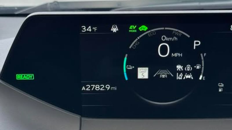 Digital instrument cluster of Gilbert's Toyota Prius showing EV mode, 34°F temperature, 2,783 miles, and various driving assistance icons.