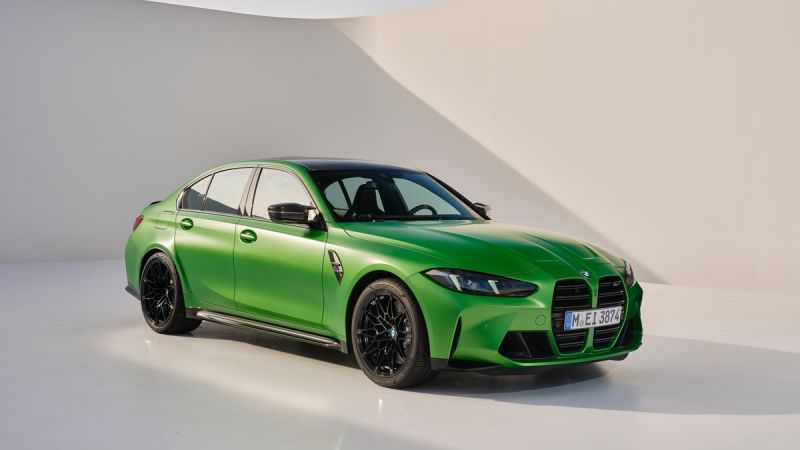 A vibrant green BMW M3 sedan with a sleek design and black accents, showcased on a minimalistic white background.
