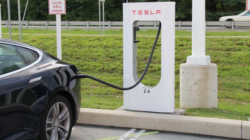 Subaru EV charging at a Tesla supercharger