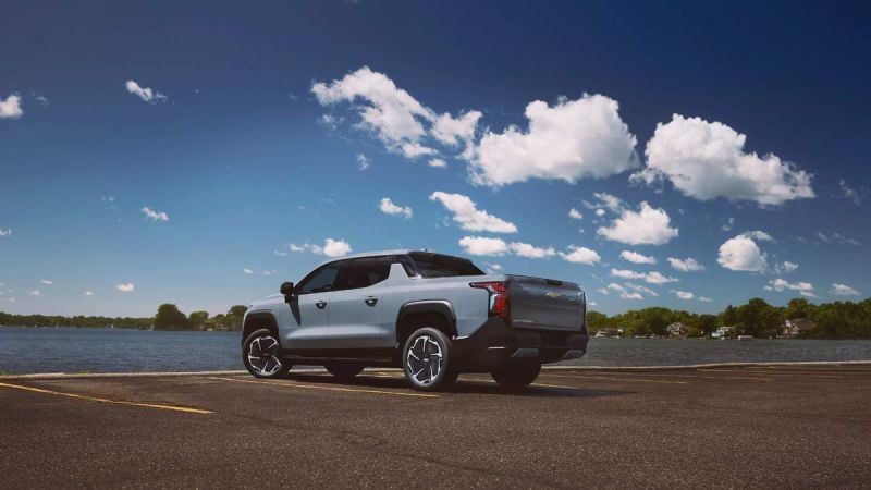Rear 3/4 angle of the 2025 Chevrolet Silverado EV LT in Slate Gray.