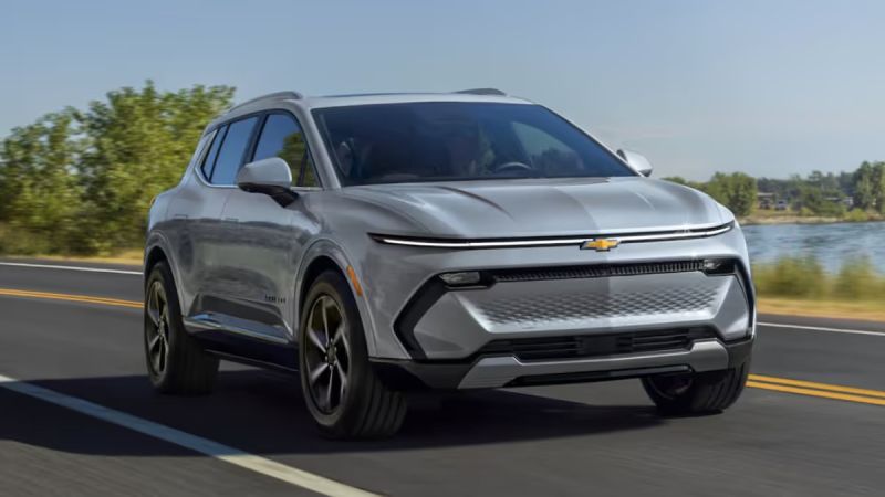2025 Chevrolet Equinox EV in gray shown at front three-quarter angle, highlighting modern electric SUV design with sleek lines.